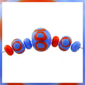 Handmade Hollow Core Glass Bead Set: 7 Lampwork Beads (Dark Periwinkle & Orange/Red)