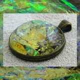Antique-Bronze Plated Pendant: Lazer Paper Set In Resin