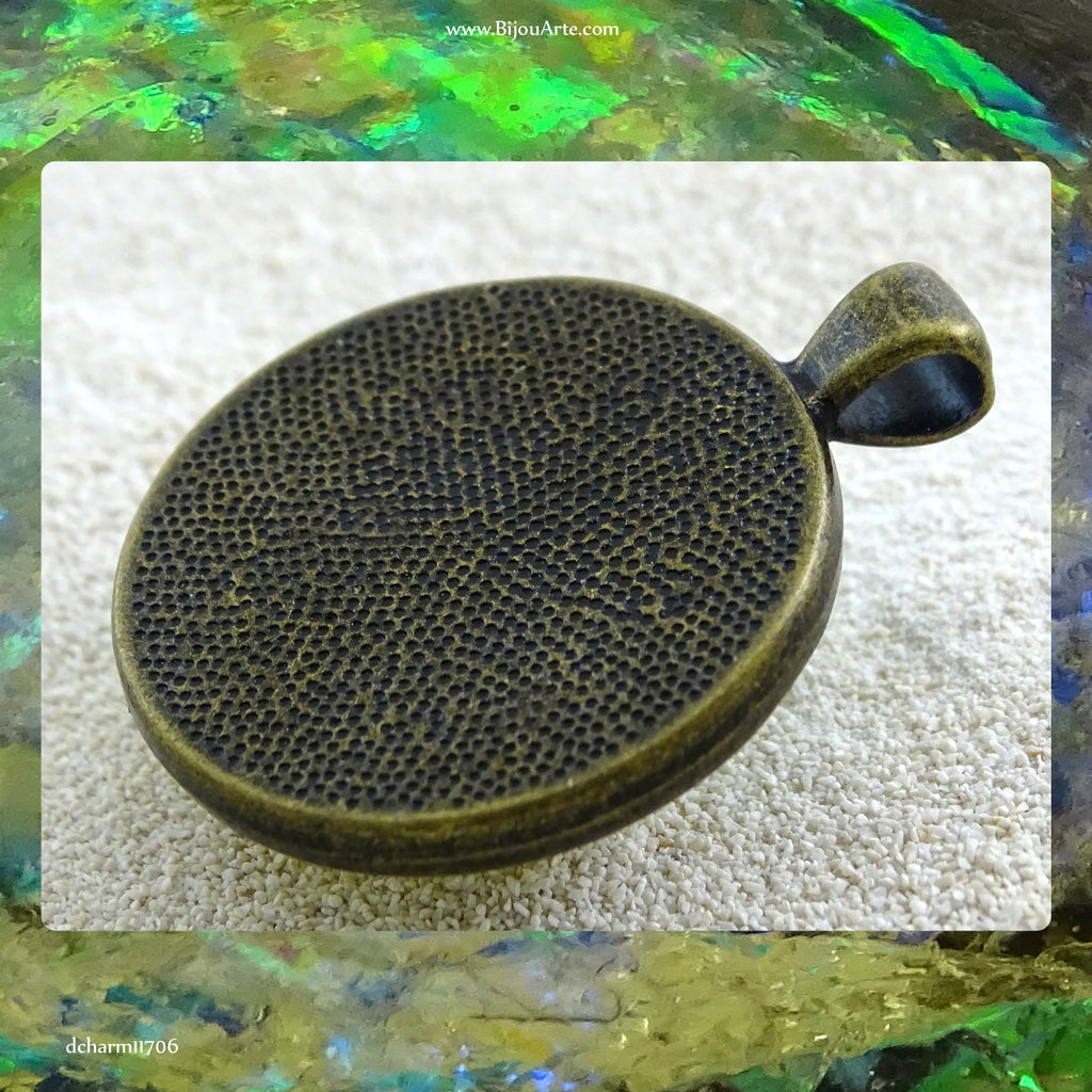 Antique-Bronze Plated Pendant: Lazer Paper Set In Resin