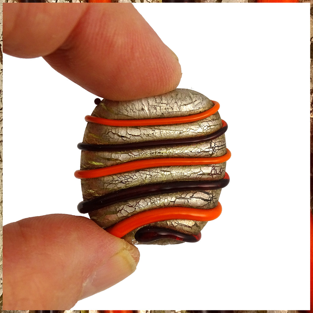 Handmade Glass Lampwork Bead: Orange Swirls on Distressed Silver Leaf