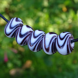 Handmade Glass Bead Set: 5 Lampwork Beads with Black & White Swirl Decoration