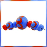 Handmade Hollow Core Glass Bead Set: 7 Lampwork Beads (Dark Periwinkle & Orange/Red)