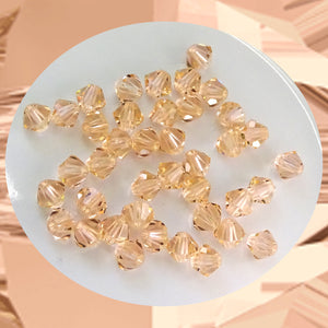 Swarovski 5328 Xilion Beads: 4mm Bi-cone / Pack of 40 / Light Peach