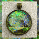 Antique-Bronze Plated Pendant: Lazer Paper Set In Resin
