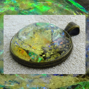 Antique-Bronze Plated Pendant: Lazer Paper Set In Resin